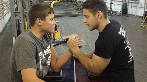 school boy arm wrestling